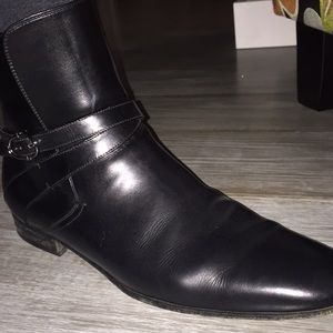 Boots with slick styling and edgy strap.